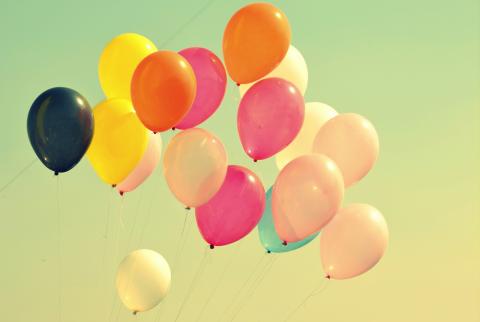 assorted-color balloons on air by Sagar Patil courtesy of Unsplash.