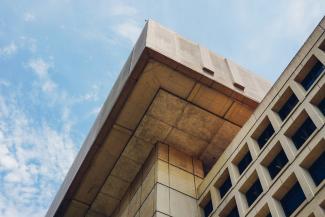 brown concrete building under blue sky during daytime by Jack Young courtesy of Unsplash.